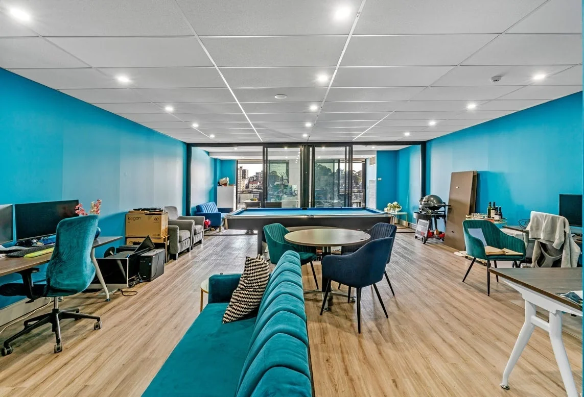 Interior of the Milsons Point office, looking towards the balcony and harbour